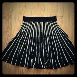 Mid length black and white knit skirt.